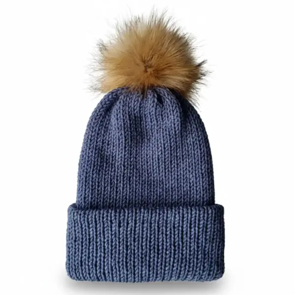 Blue beanie hat with brown pom-pom on white background