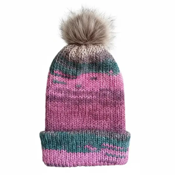 Pink and teal knit hat with brown faux fur pom-pom on a white background, featuring gradient stripes